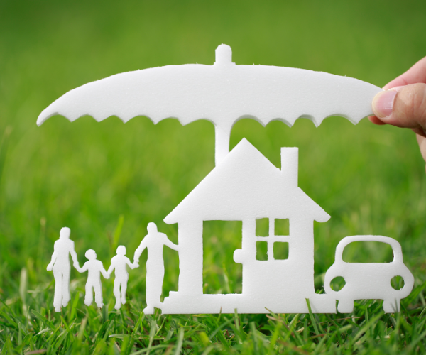 paper cutout of family, house, and car under umbrella to represent insurance policy review