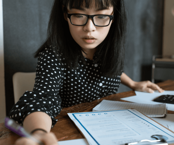 young asian american woman financial planning