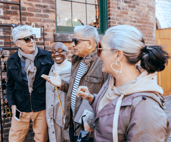 retired multi-racial couples travel together and talk